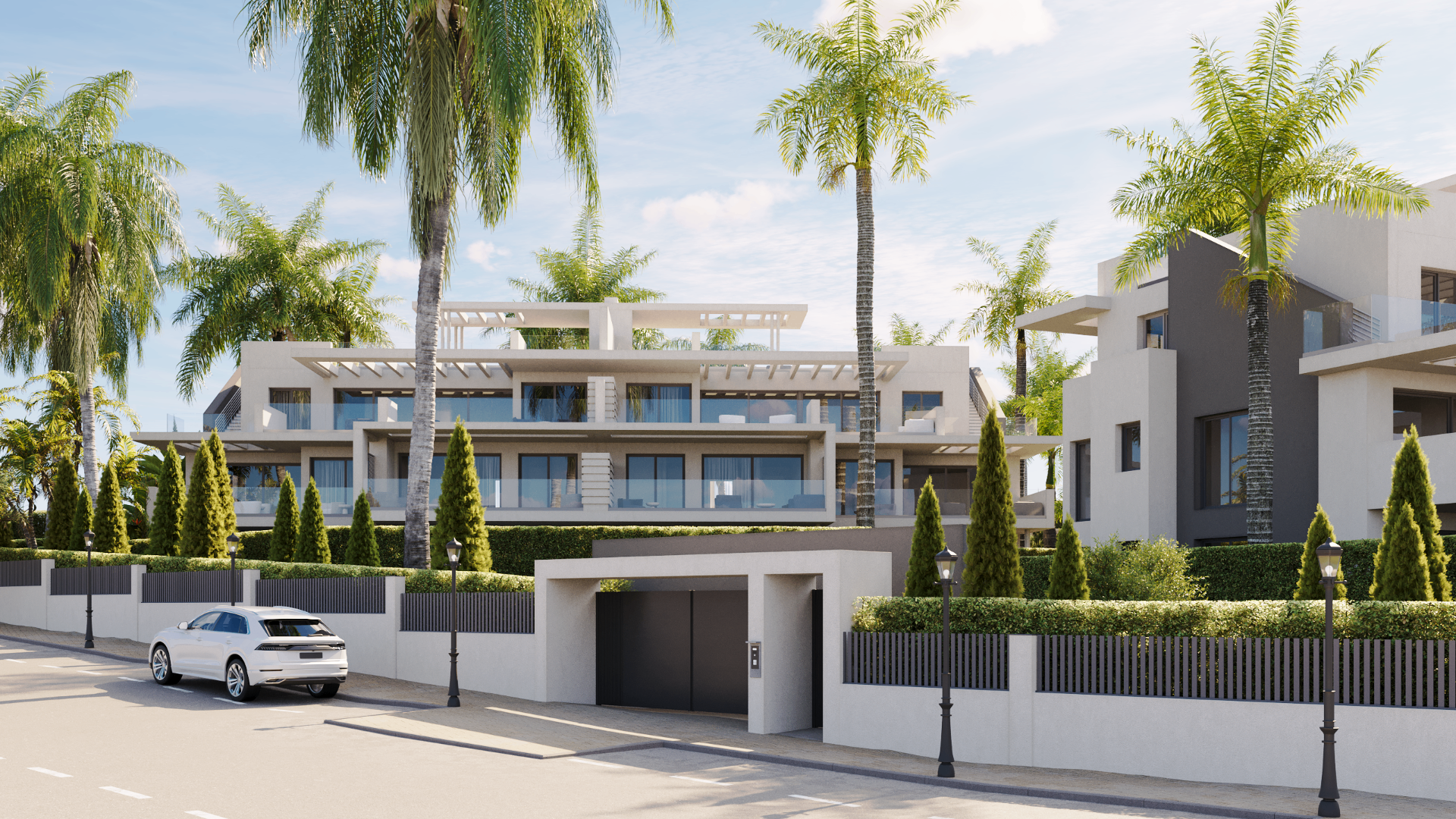 Contemporary white façade of the Estepona boutique residence with palm-lined street